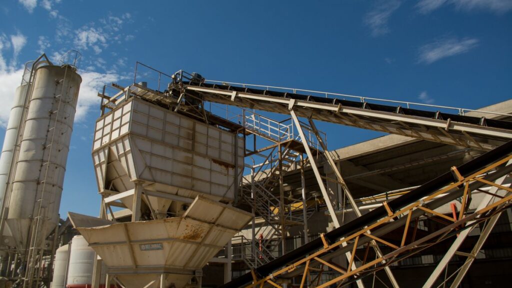 Conveyors and hoppers at an industrial bulk material plant