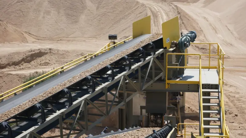 Granite quarry belt conveyor driven by a Dodge Motorized Torque-Arm reducer in the aggregate industry